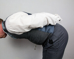 Butler Bowing Politely to Honored Guest. Professional Hospitality and Courtesy.