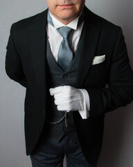 Butler or Hotel Concierge in Formal Attire At Your Service. Professional Hospitality and Courtesy.