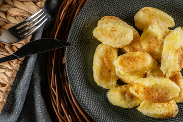 Homemade lazy noodles with cheese, crumbs and melted butter.