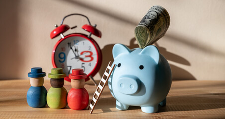 Blue piggy bank with ladder and $1 bill