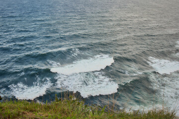 Ocean waves crashing against rocky coastline, Azores