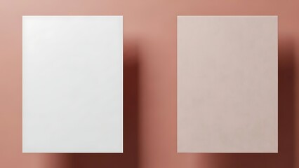 Two blank white sheets on a pink surface viewed from directly above