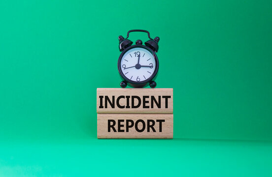 Incident Report symbol. Concept word Incident Report on wooden blocks. Beautiful green background. Business and Incident Report concept. Copy space