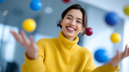 Smiling professional woman surrounded by colorful floating spheres symbolizing multitasking, creativity, and modern productivity.
