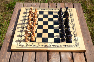 Chessboard with Chess Pieces on Table