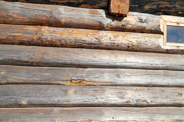 Rural Wooden Bathhouse with Log Construction and Window
