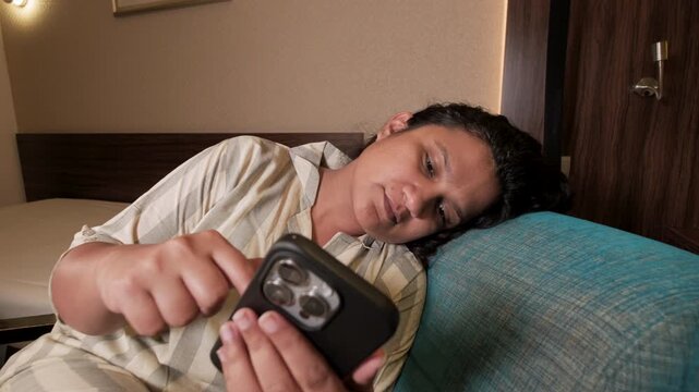 tired woman watching reels at night in bed, doom scrolling and insomnia, burnout, mental health concept stock video