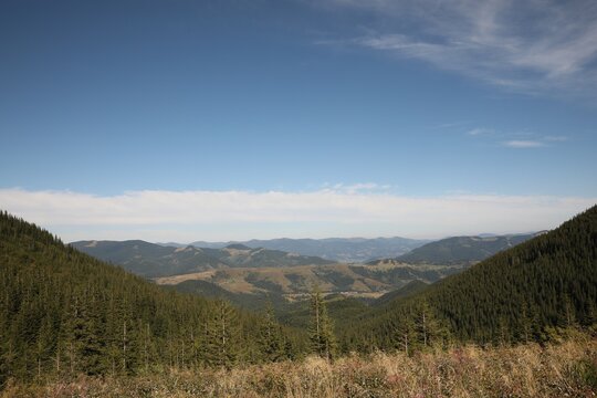 Picturesque view of sky with clouds over mountains