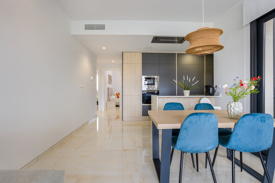 Open concept kitchen and dining room with hallway to bedrooms