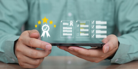 Man using digital tablet with holographic icons showing customer feedback, five-star ratings, and quality assurance analytics.
