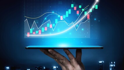 A sleek tablet device held in a hand displays vibrant stock trend graphics in a digital financial analysis environment, embodying modern trading technology and insights. Copula