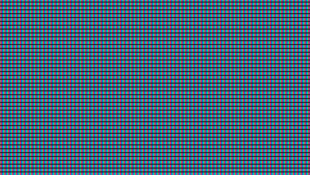 Close up of a crt screen with red green and blue pixels forming a grid. Abstract pattern background for graphic or web design.