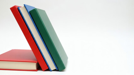 Colorful books leaning with blank space for text 