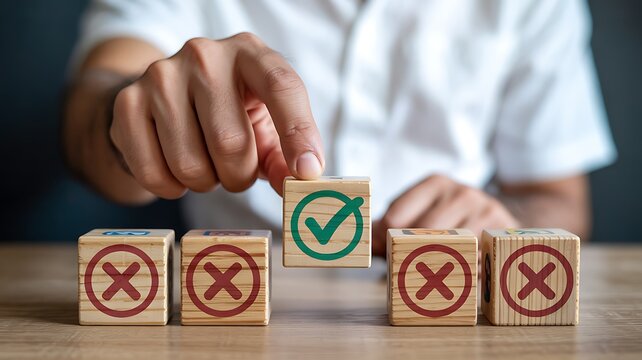 Identifying the Best Option: Hand Placing Green Checkmark Amidst Red X Marks