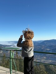 girl on the top of the mountain