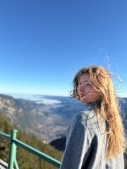 girl on the top of the mountain