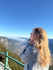 girl on the top of the mountain