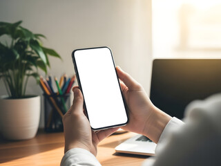A businessman in an office holds a digital tablet and smartphone, using wireless technology and mobile devices to stay connected through the internet while working