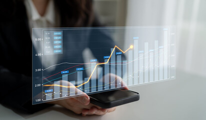 A professional businesswoman is analyzing data trends displayed on her smartphone while seated in a modern office, showcasing technology in business analysis. Scalp