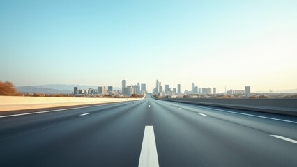 Obraz premium wide open road from low angle perspective leading toward distant city skyline under clear sky minimal highway scene with strong depth and freedom feeling concept of travel transportation