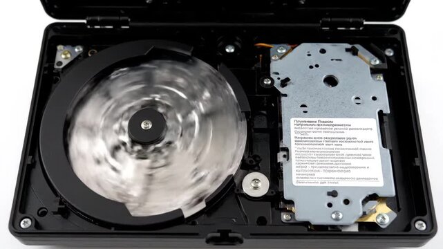 Open hard disk drive mechanism in realistic industrial style, black and metallic tones, data storage technology and computer hardware concept