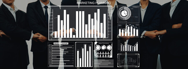 Business professionals collaborate over digital analytics and charts, highlighting strategic marketing planning and data analysis for modern business success. Axiom