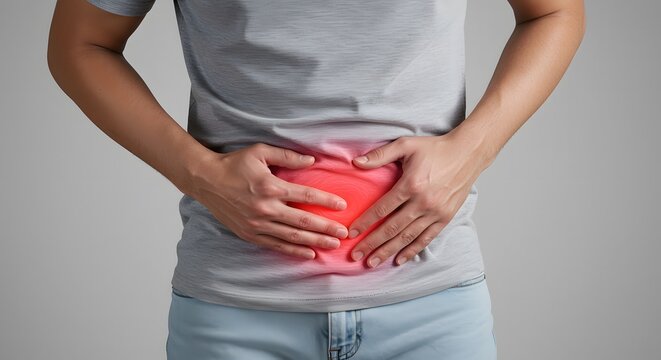 Person suffering from severe abdominal pain or stomach ache, highlighted with red glow