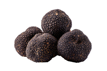 Close-up of four black truffle spheres clustered together.  Dark, bumpy exteriors