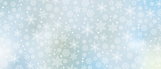 Winter background with white snowflakes on light blue gradient, banner format