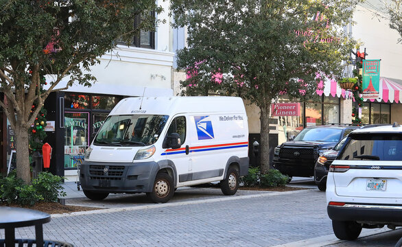 United States Postal Service (USPS) delivery van parked on Clematis Street in downtown West Palm Beach, Florida, USA. 