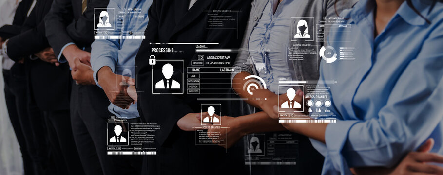 A group of business professionals stands in a modern office, showcasing digital profiles and innovative technology that symbolizes teamwork and connectivity in a corporate setting. Trope - Powered by Adobe