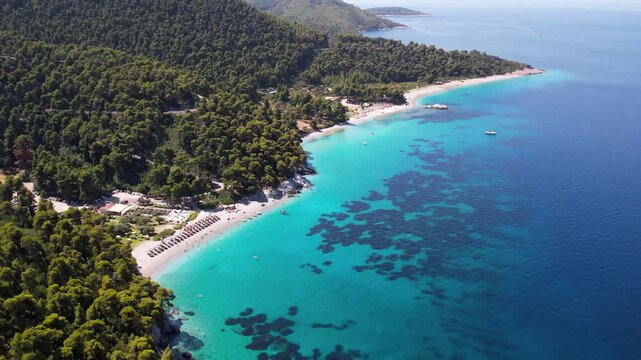 Aerial View of Kastani and Milia beach with Dasia Islet Covered with Pine Trees, Crystal Clear Turquoise Sea, Coast of Skopelos, Greece