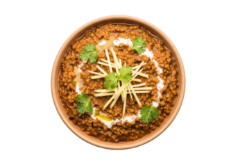 dal makhani in clay bowl with sev garnish and cilantro