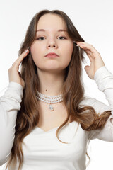 Portrait of a beautiful young girl with jewelry