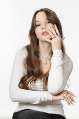 Portrait of a beautiful young girl with jewelry
