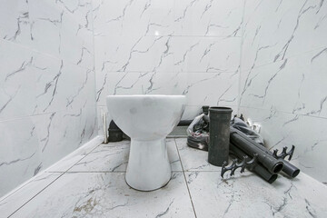 the toilet was clogged and water ran through, a red rag to collect water from the drain corrugation. Urgent plumbing repairs