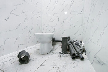 the toilet was clogged and water ran through, a red rag to collect water from the drain corrugation. Urgent plumbing repairs