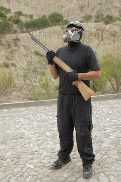 Soldier with a gas mask and rifle