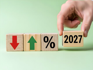 Wooden blocks with up down arrows and percentage showing 2027 mixed market trends and economic forecast variations