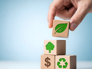 Hand holding wooden block with green leaf symbol among sustainability icons representing environmental business practices
