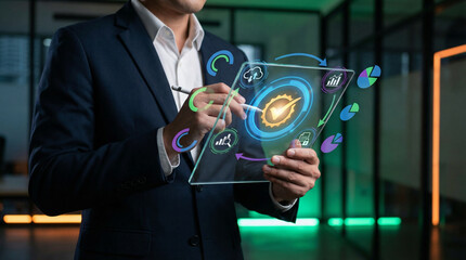 Businessperson using stylus on transparent digital tablet with icons for charts, cloud, documents, and quality badge, symbolizing data analytics, process management, and digital transformation