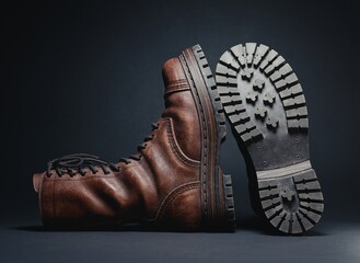 3d rendering of retro brown leather boots on a dark background. High vintage lace-up design with realistic scuffs and a worn-out look. Detailed heavy sole with tread patterns. Footwear concept.