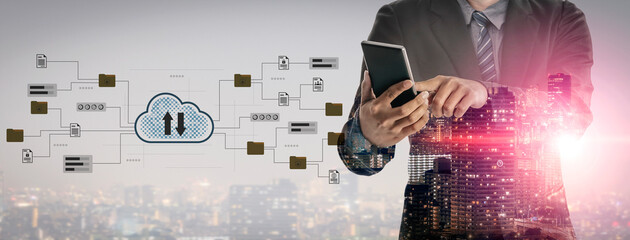 A businessman in a suit uses a smartphone amidst a blend of cloud technology and data flows, symbolizing the integration of communication and innovation in urban settings. Gantry