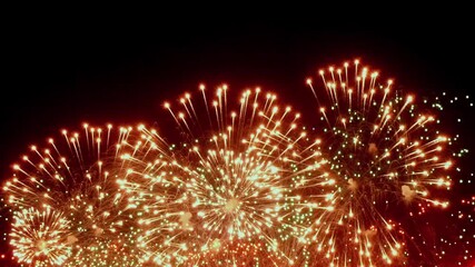 Brilliant colors burst in slow motion, filling the sky with festive cheer, as holiday celebrations resonate with the magic of Christmas fireworks.