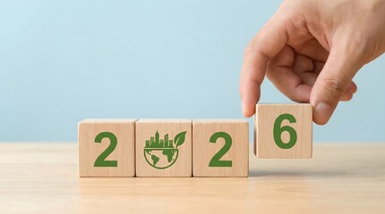 2026 eco friendly concept with hand placing wooden block