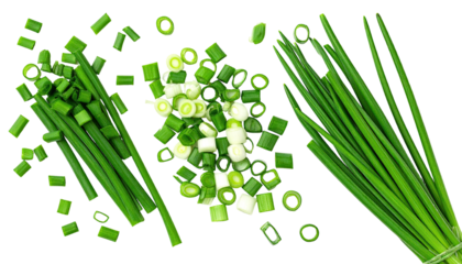 Close-up top view of freshly cut green chives, some whole, others chopped, on black