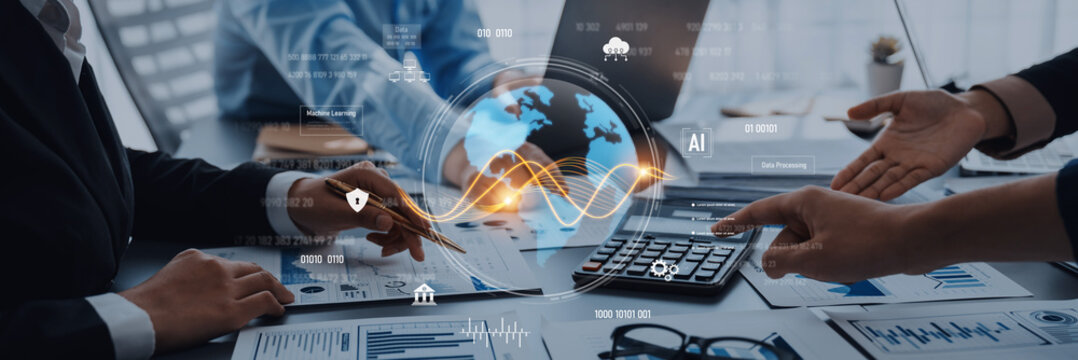 Close-up view of a business meeting showing hands interacting with digital graphs and charts, symbolizing financial analysis and global trends in a professional setting. Trope - Powered by Adobe