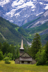 Old wooden church in the Alps. Kandersteg, Switzerland, Europe. World of beauty.
