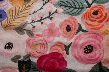 Floral fabric texture with colorful flowers pattern close up