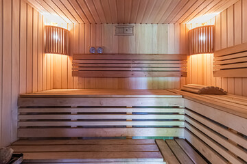 Inside of usual standart wooden sauna room interior with backlight